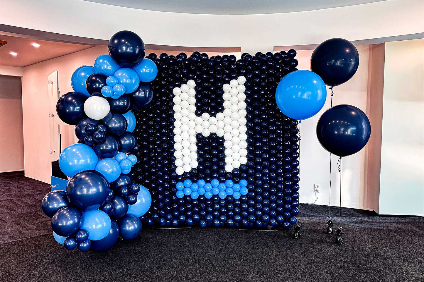 Custom balloon mural backdrop for events in Auckland, perfect for birthdays, corporate functions and celebrations