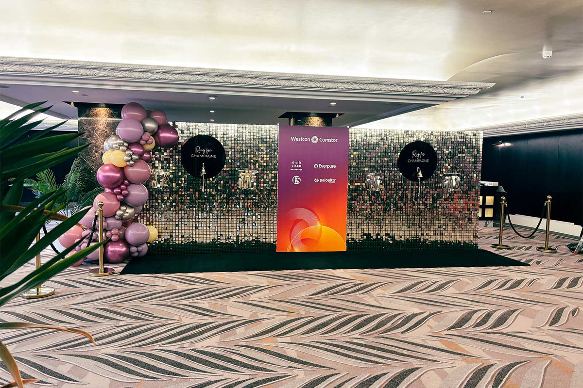 Champagne wall hire for weddings, corporate events and celebrations with stylish display holes for serving champagne glasses.