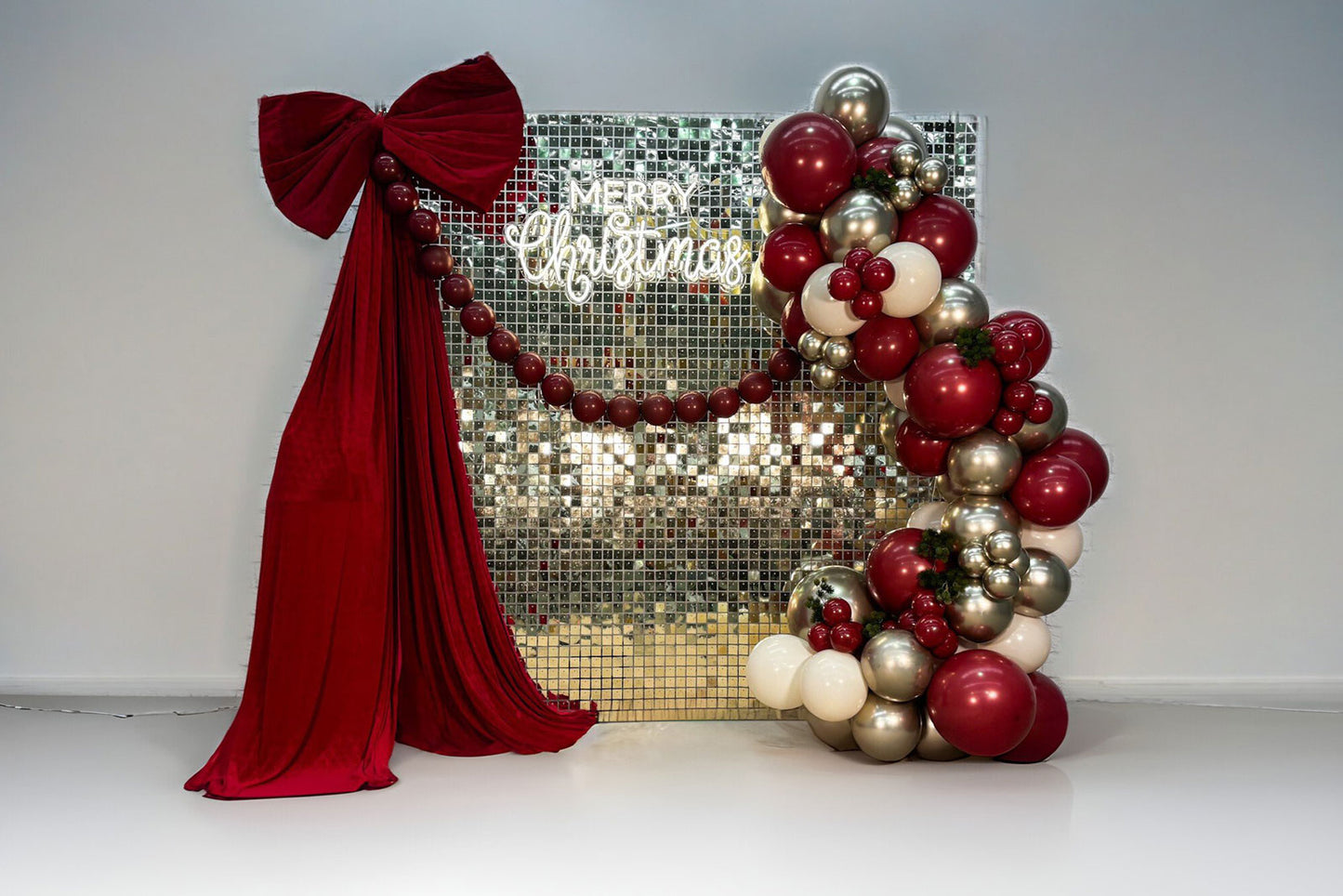 Christmas festival backdrop with festive balloon display featuring seasonal colours and decorations for holiday events, parties and celebrations in Auckland