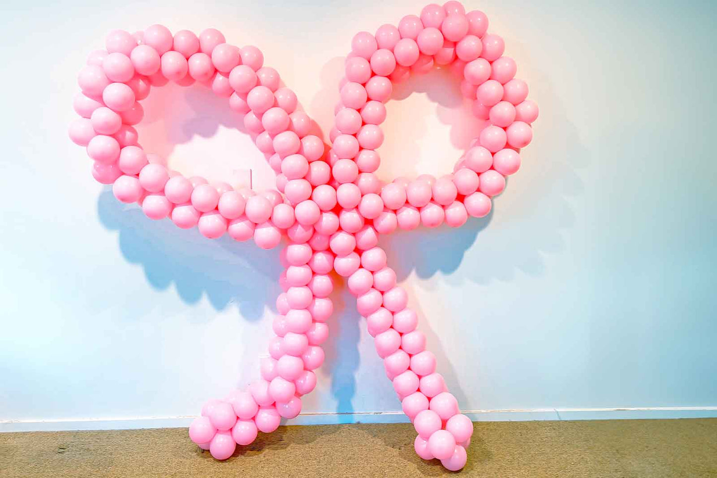 Decorative balloon bow for birthdays, celebrations, and event styling