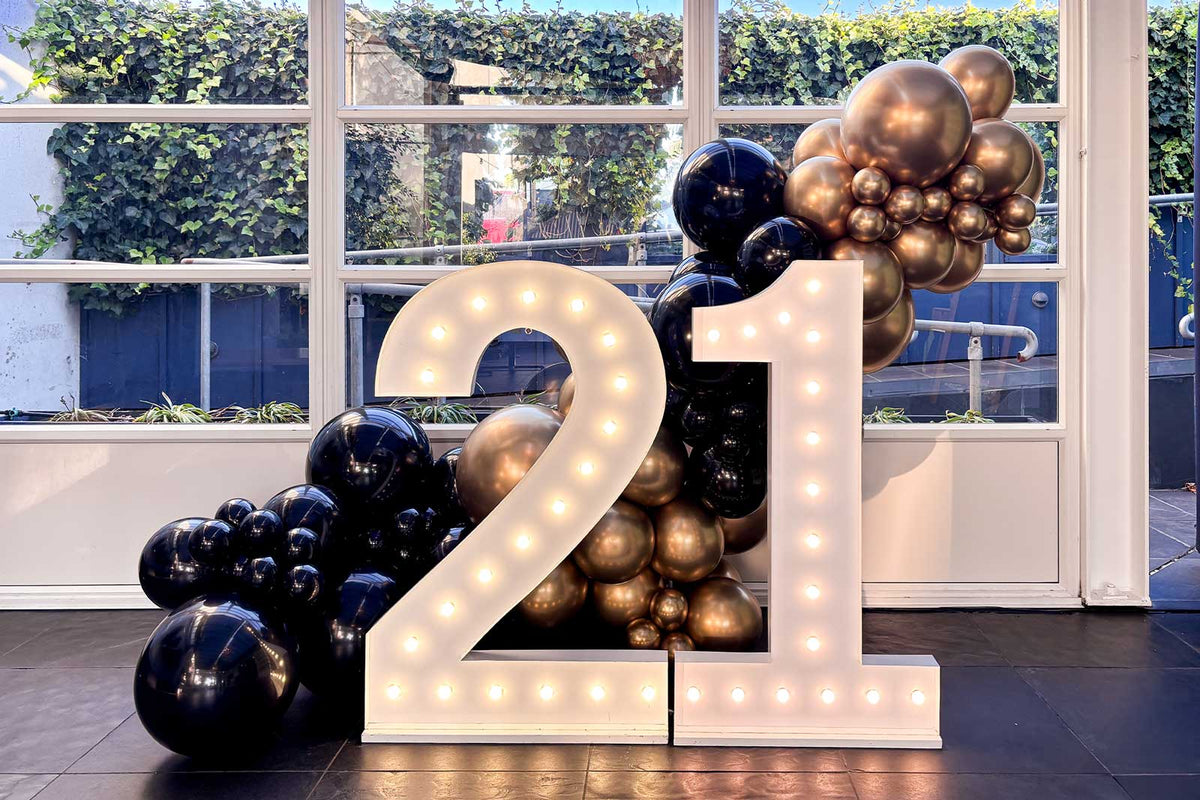 Light up numbers with balloon display for 21st birthday event in Auckland