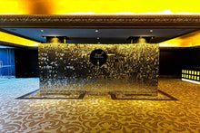 Load image into Gallery viewer, Live champagne wall setup at a corporate event in Auckland with guests enjoying drinks
