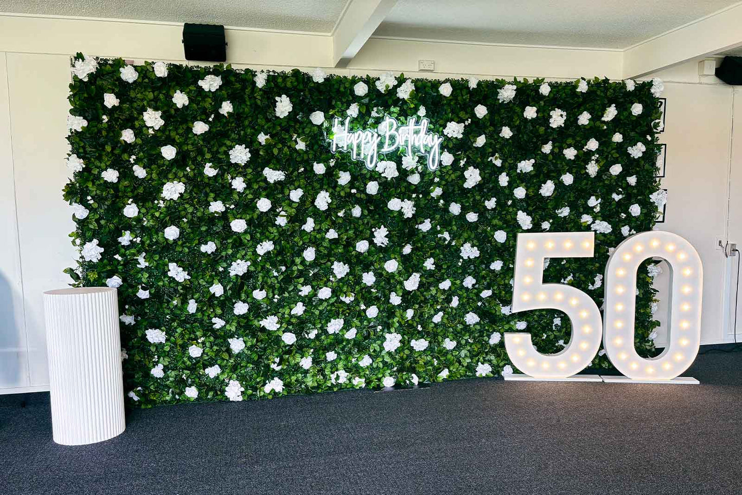 Miss Jasmine Flower Wall for a 50th birthday celebration styled with marquee lights for hire in Auckland.