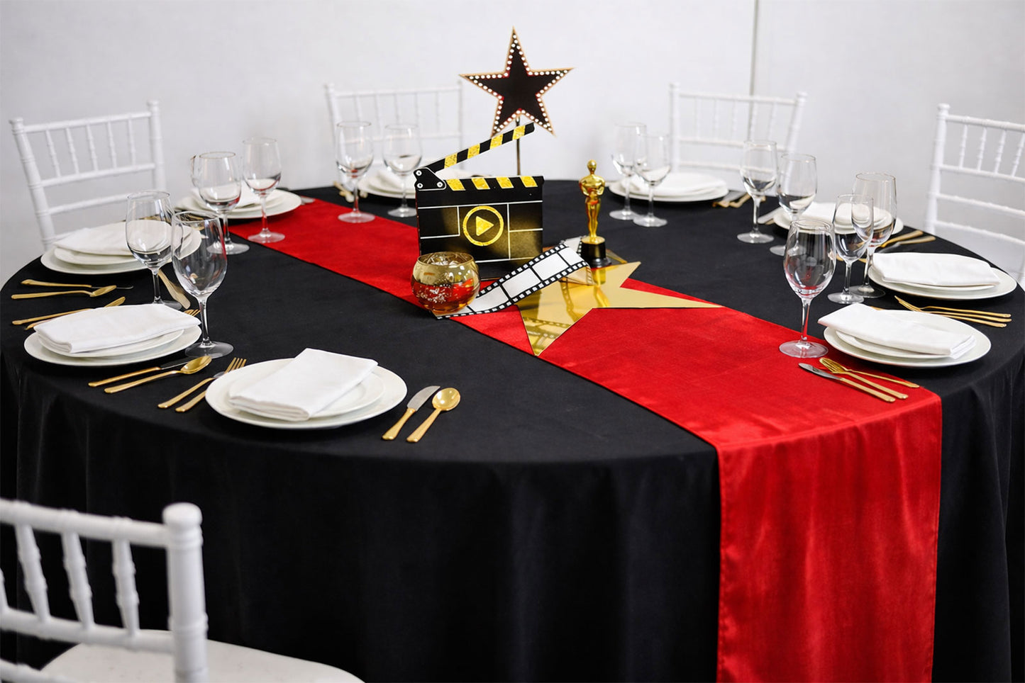 Elegant Oscars awards night centrepieces featuring gold accents and cinematic decor for gala tables
