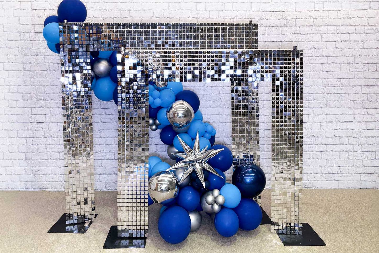 Shimmer wall arch backdrop creating a modern and elegant photo feature for events