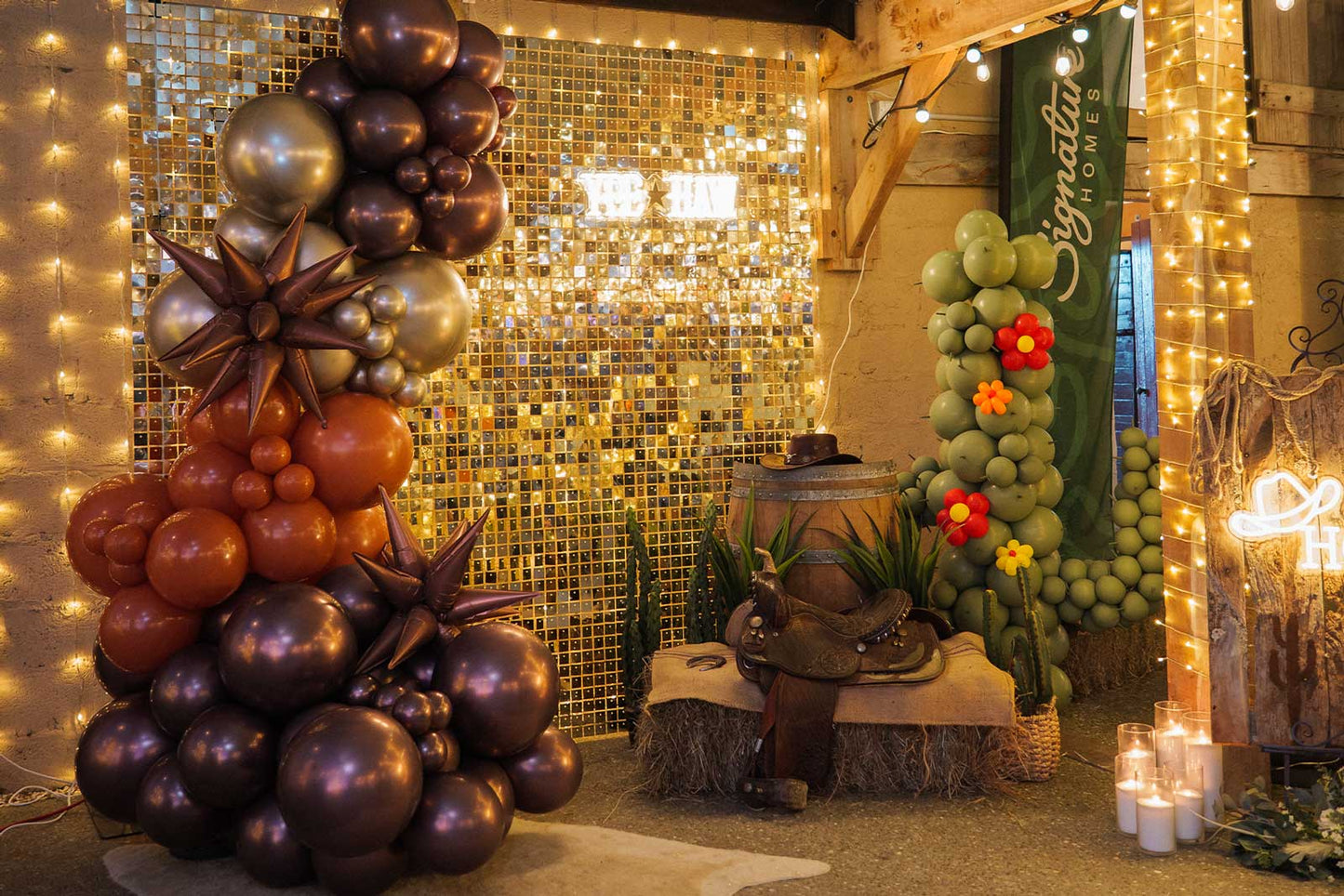 White shimmer wall backdrop styled for a Western-themed party setup