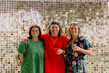 Load image into Gallery viewer, “Let’s Party” neon sign with balloons at a celebration event in Auckland