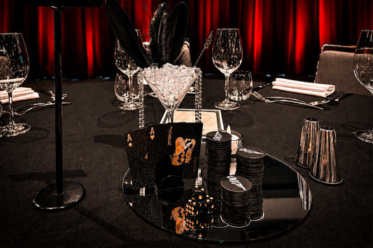 007 James Bond themed centrepieces with elegant black and gold styling for a corporate event