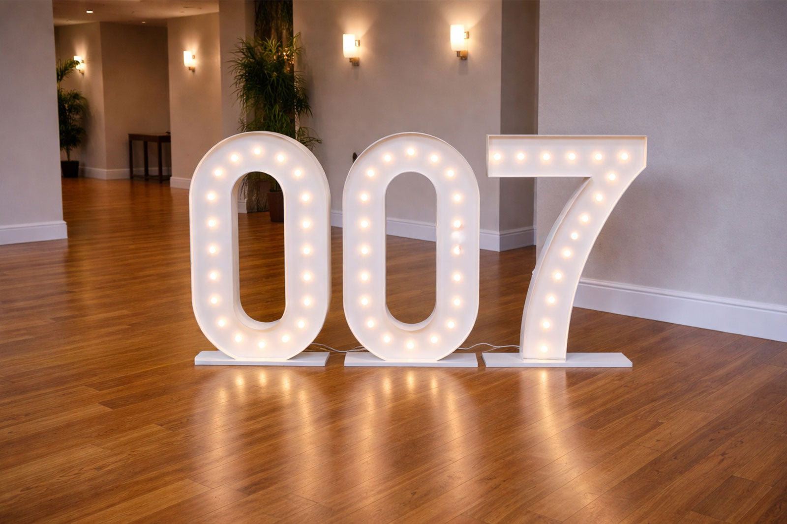 007 themed marquee lights with illuminated numbers for James Bond party backdrop