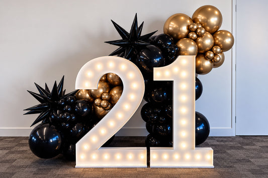 21 marquee lights with a colourful balloon arrangement for a birthday celebration or special event.