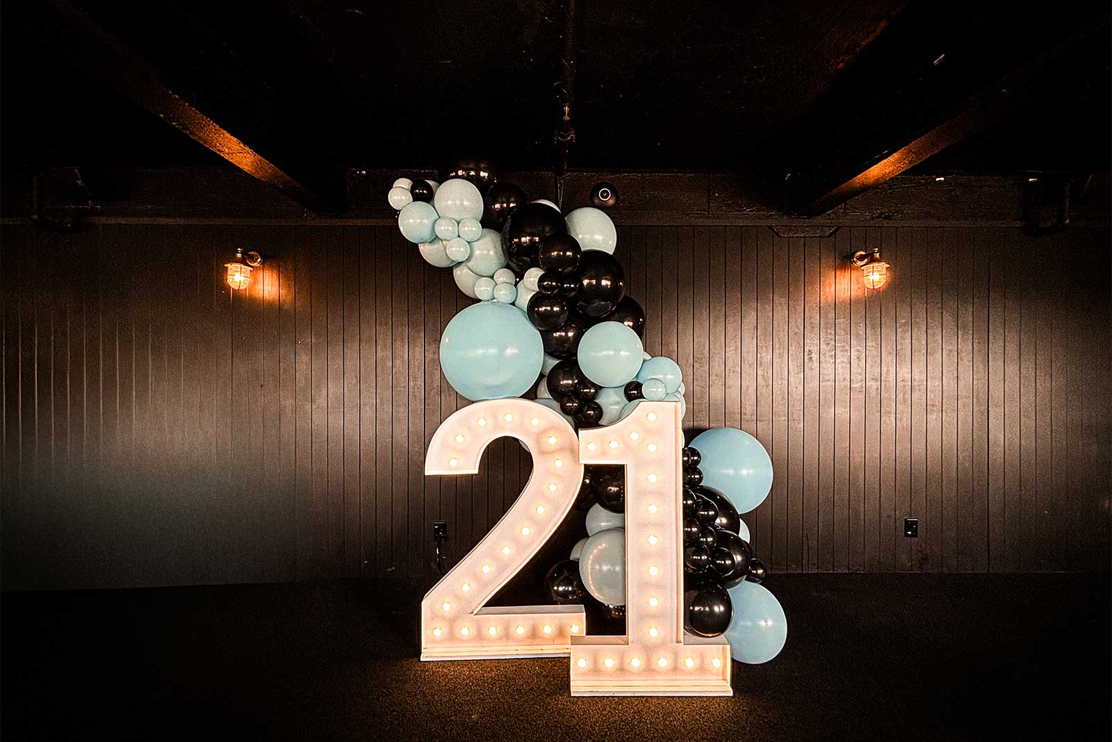 21st birthday decorations with balloon garland and backdrop display for a celebration in Auckland