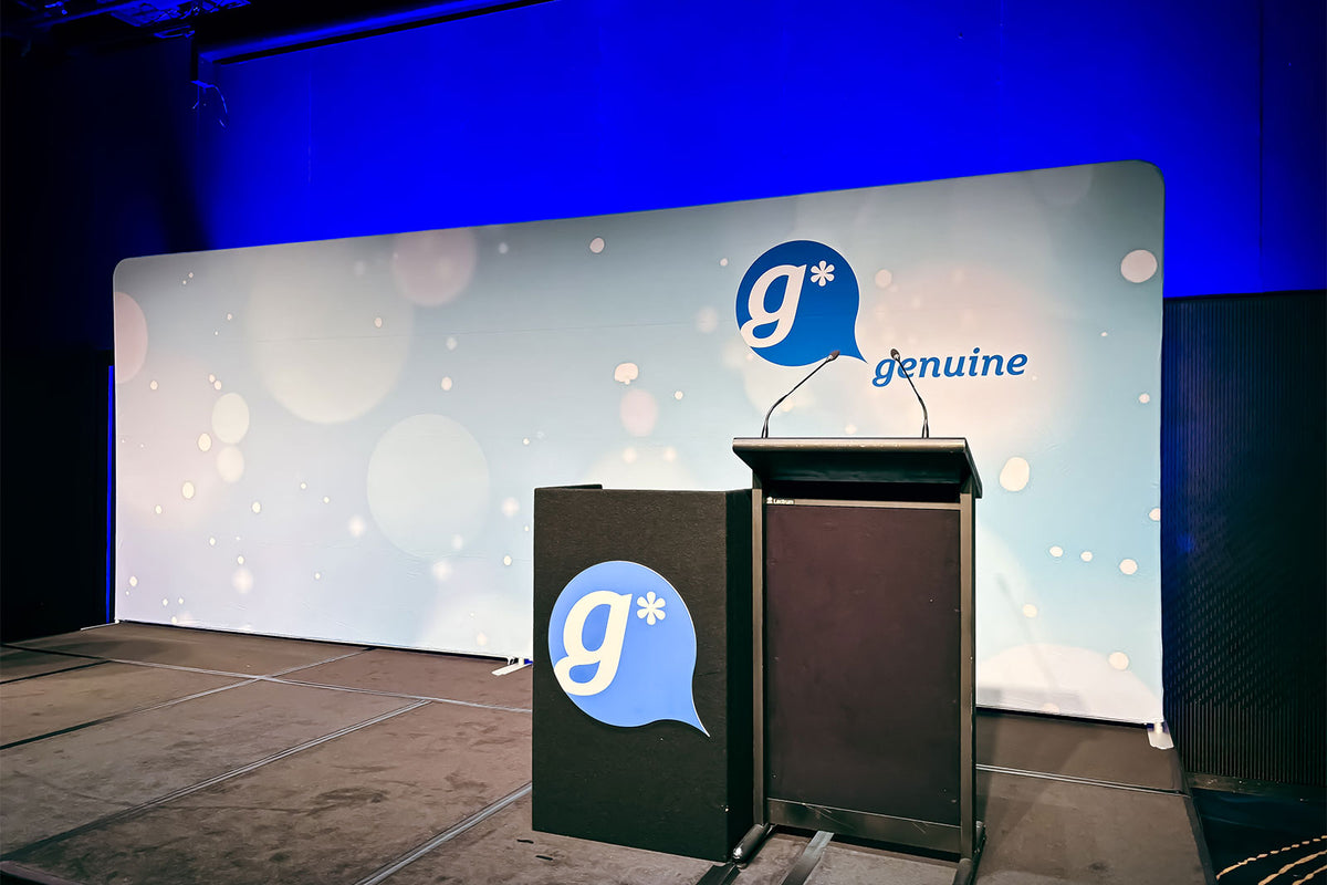 Large 5.9m straight tension backdrop displaying custom branding for corporate events, exhibitions and media launches.
