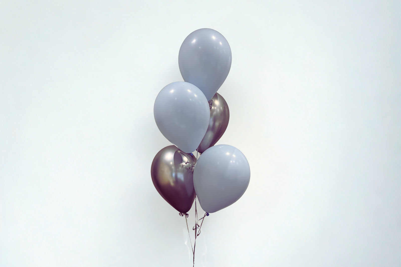 5 balloon helium bouquet arrangement in matching colours for party and event decor in Auckland