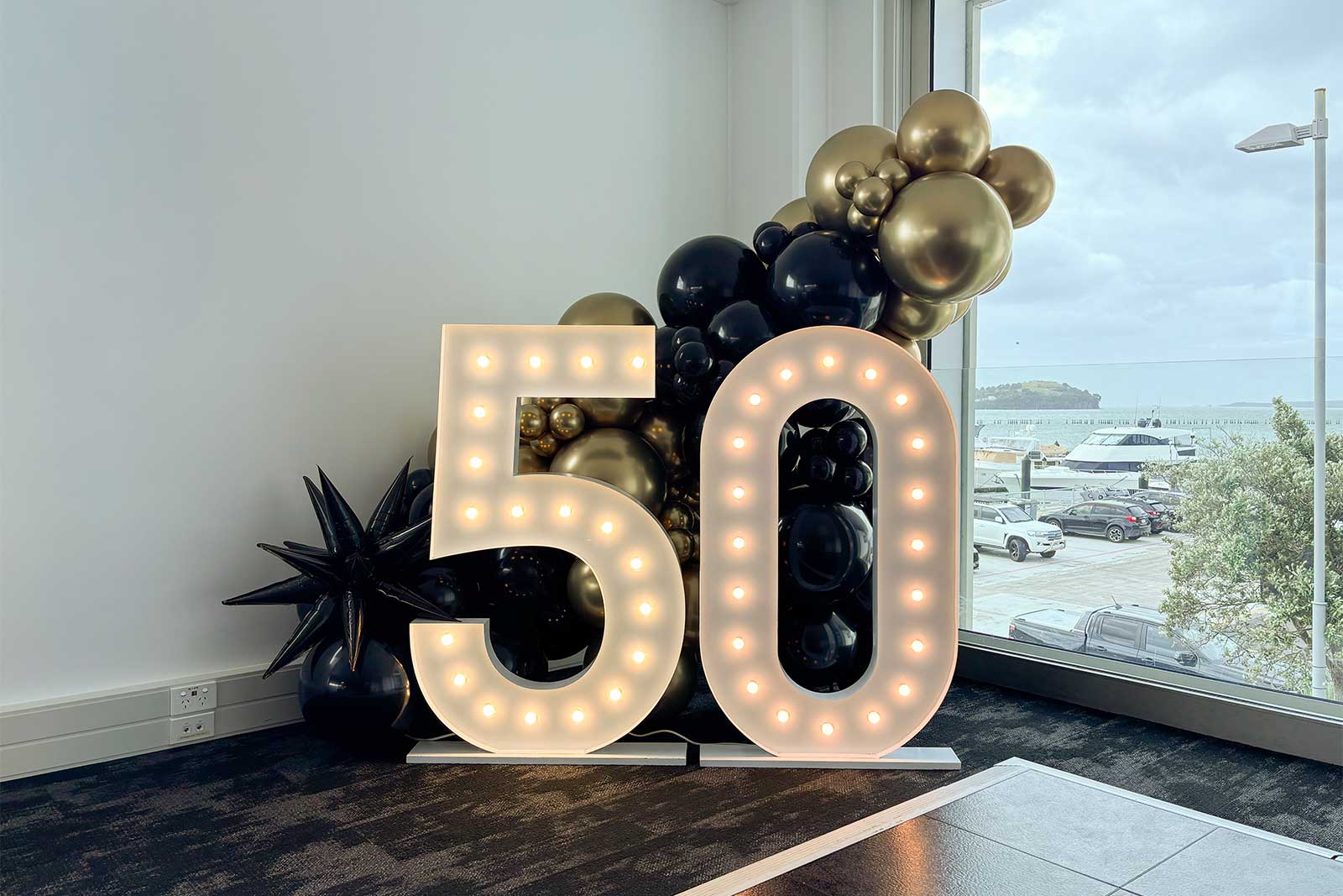 50th birthday marquee lights with balloon garland decoration for a celebration in Auckland