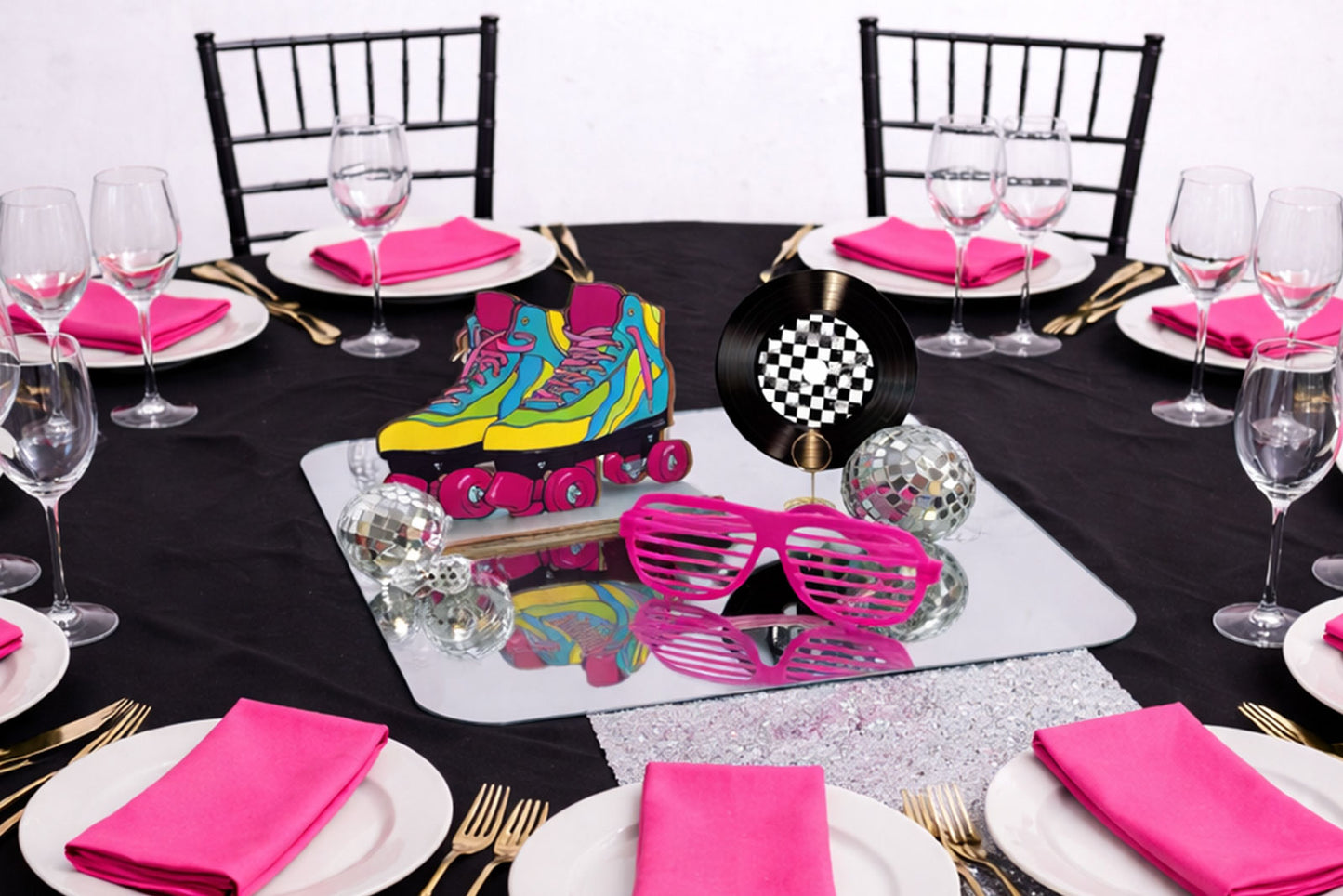 Coloruful 80s retro party centrepiece with neon accents and fun nostalgic decor for event tables