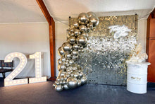 Load image into Gallery viewer, Decorative setup with white gold balloons, a shimmer wall, and a large number &#39;21&#39; in a room.
