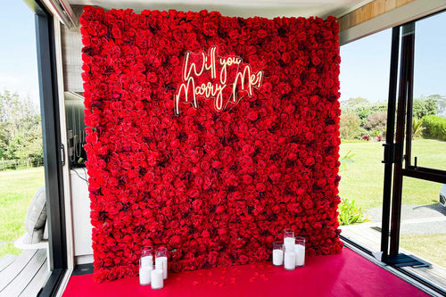 Floral wall with 'Will you marry me?' 