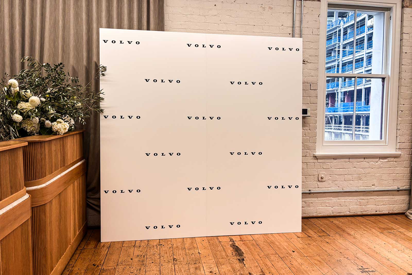 Branded corporate media wall in Auckland used for company events, photo opportunities, and professional brand exposure.