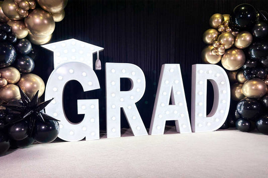 Graduation party backdrop and decorations for celebrating graduates in Auckland