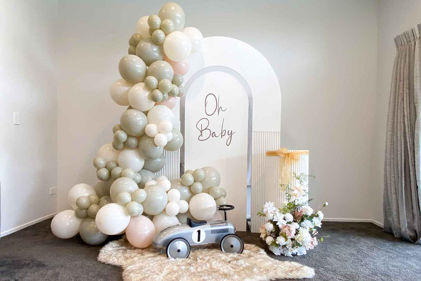 Elegant baby shower backdrop creating a stylish photo area for celebrations