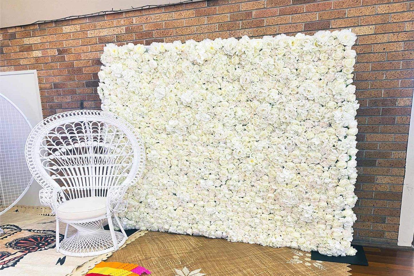 White flower wall backdrop for baby shower decorations and photos