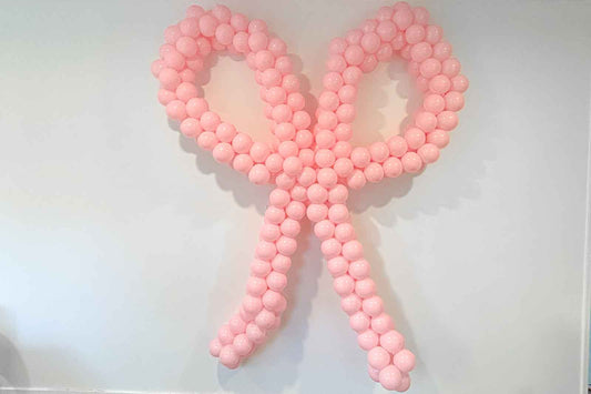 Balloon bow for hire to add a stylish and festive touch to parties and events