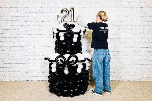 Balloon cake display for events and celebrations, stylish balloon arrangement available in Auckland