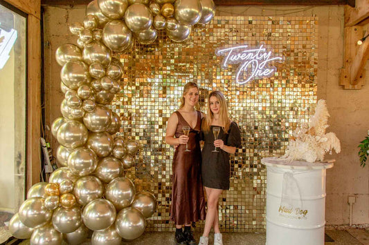 Birthday shimmer wall backdrop with premium sequin panels, balloon garland and luxury event styling for celebrations in Auckland, NZ.