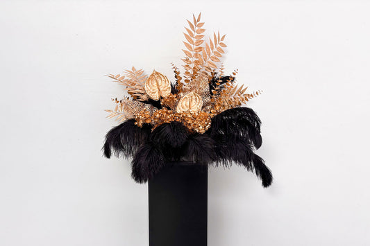 Black feather with luxurious gold floral arrangement, perfect for corporate events and formal celebrations in New Zealand.