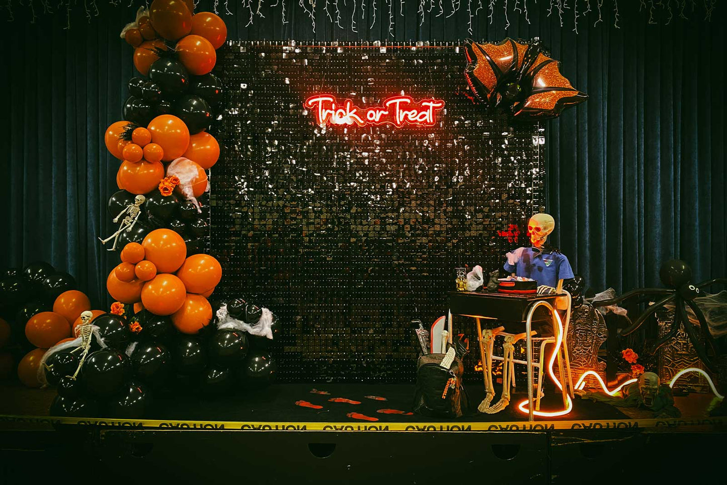 Black shimmer wall backdrop styled for a Halloween event and party in Auckland NZ
