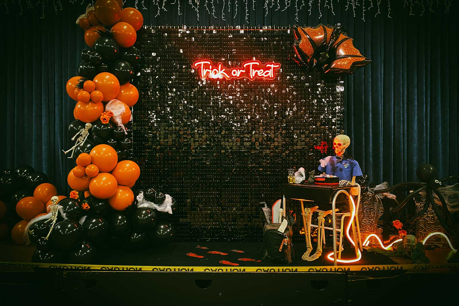 Black shimmer wall backdrop styled for a Halloween event and party in Auckland NZ