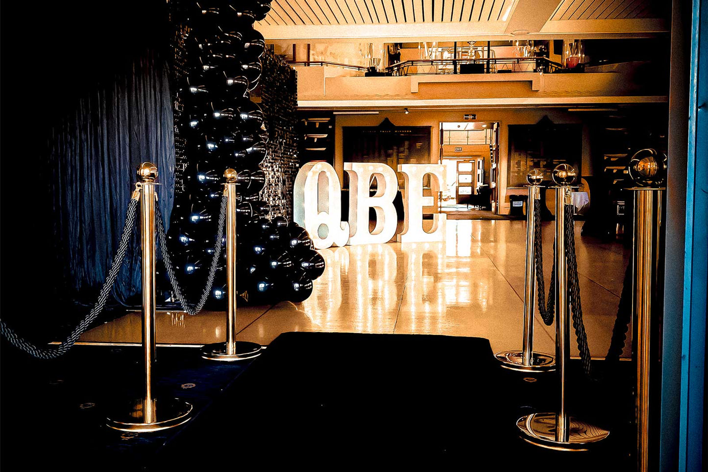 Black stanchions with ropes for corporate events, launches, and formal functions