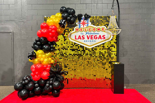 Casino Las Vegas themed backdrop with luxury event styling, balloon garlands and custom signage for corporate events, casino nights and themed parties in Auckland, NZ.