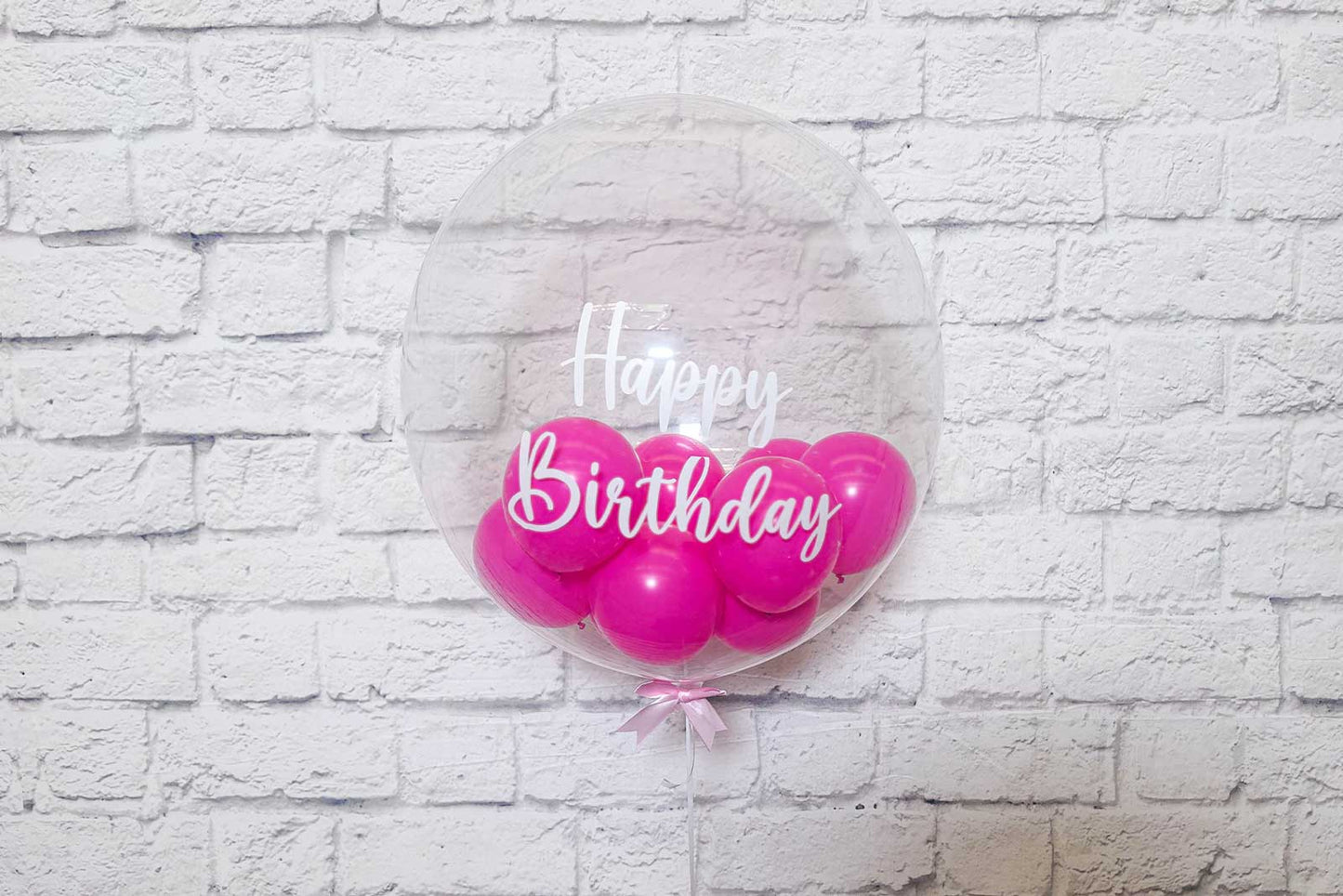 Clear bubble balloons styled for weddings, celebrations, and photo areas