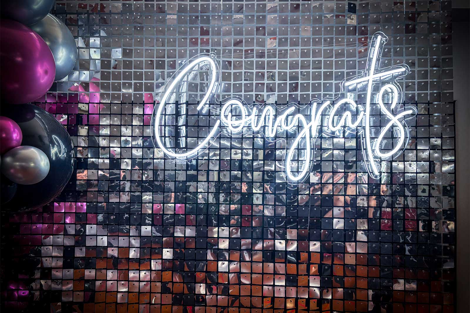 Congrats neon sign glowing on event backdrop