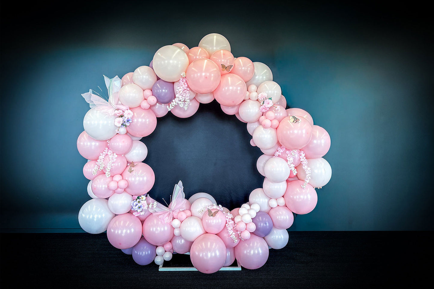 Corporate balloon hoop display with branded balloon garland for business launches and promotional events