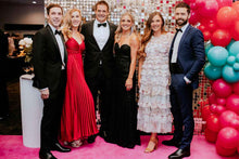 Load image into Gallery viewer, Auckland corporate celebration featuring people enjoying the event with a shimmer wall backdrop
