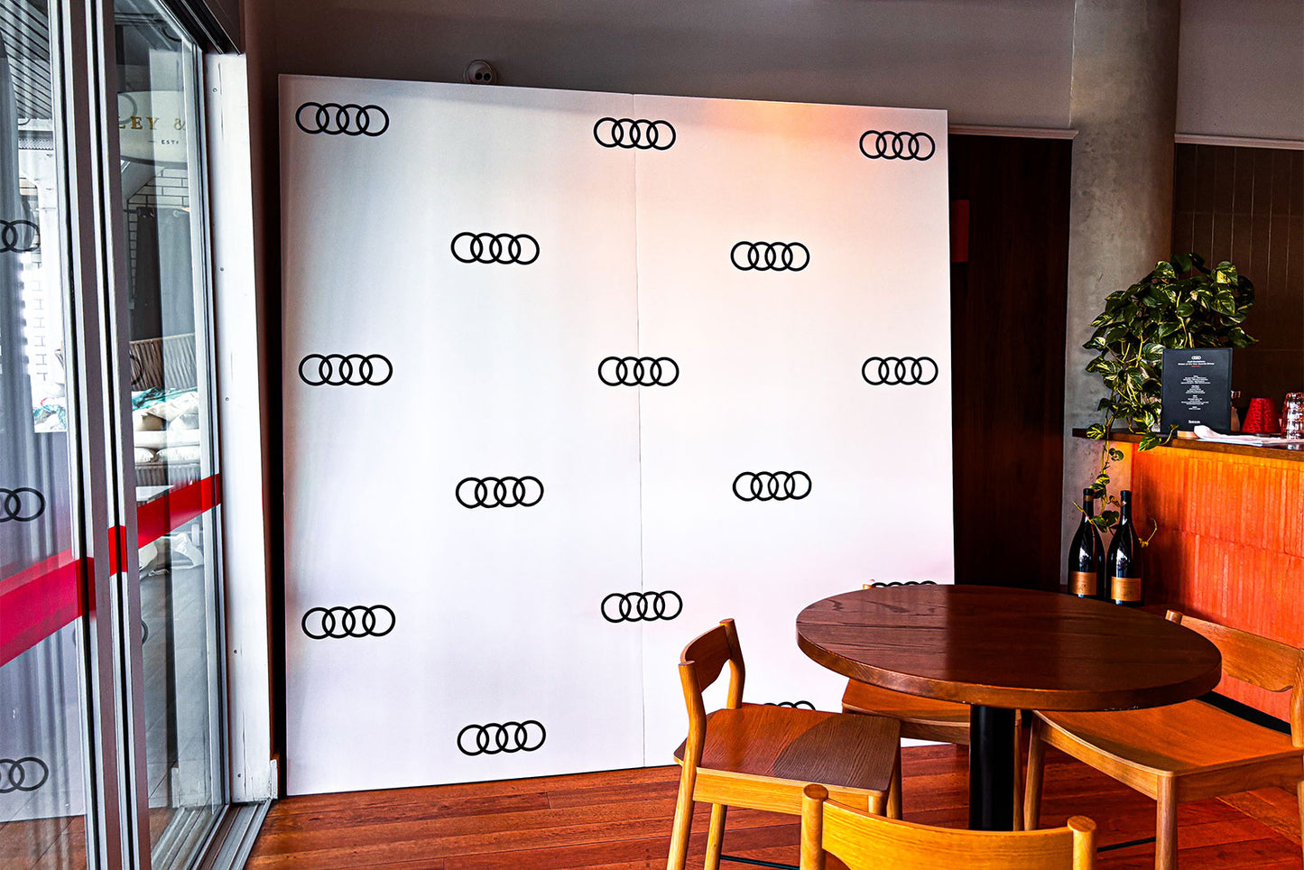 Corporate media wall with branded backdrop for business event in Auckland,