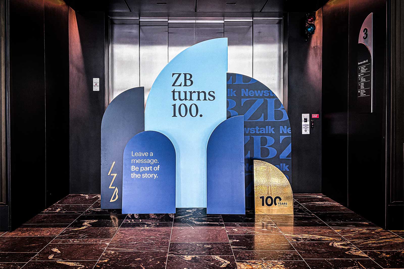 Custom corporate arch backdrop with branded graphics, professional event styling, and high-quality printed display for conferences, trade shows, awards nights, and business events in Auckland.