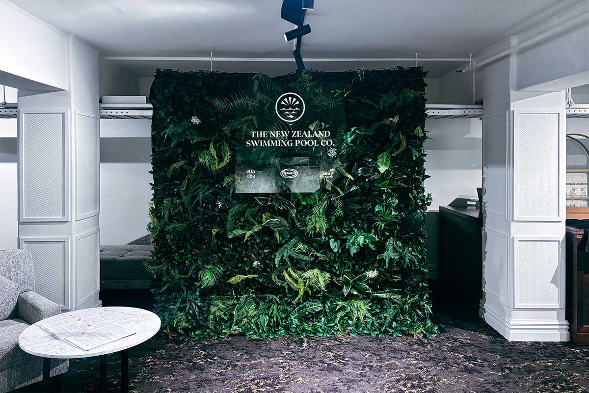 Custom event signage designed to match a tropical themed event backdrop