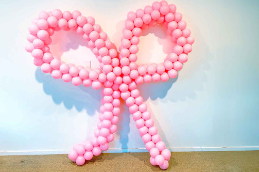 Decorative balloon bow for birthdays, celebrations, and event styling