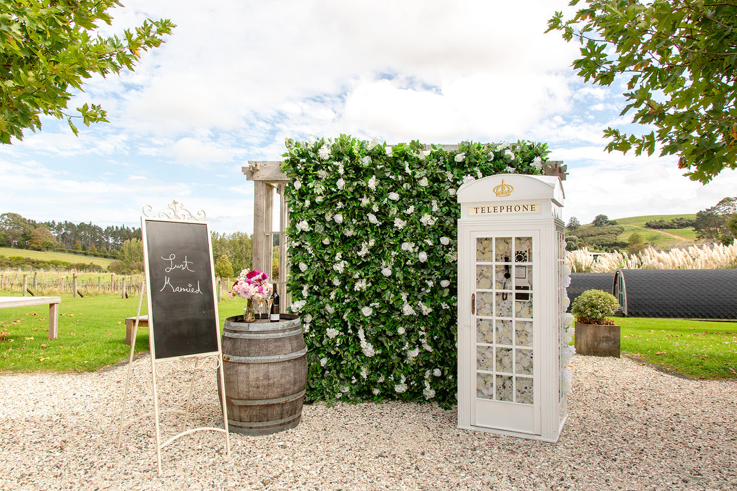 Floral wall backdrop with Phone Booth for corporate events, networking, and team celebrations in Auckland