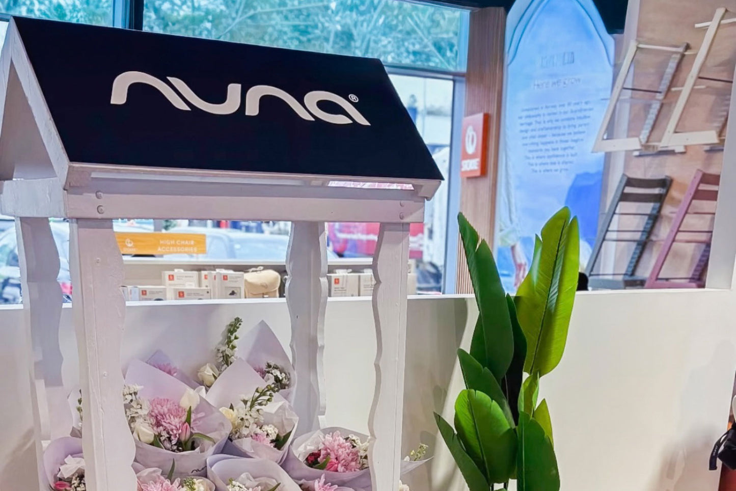 Flower cart hire styled with fresh floral arrangements for a corporate event in Auckland.