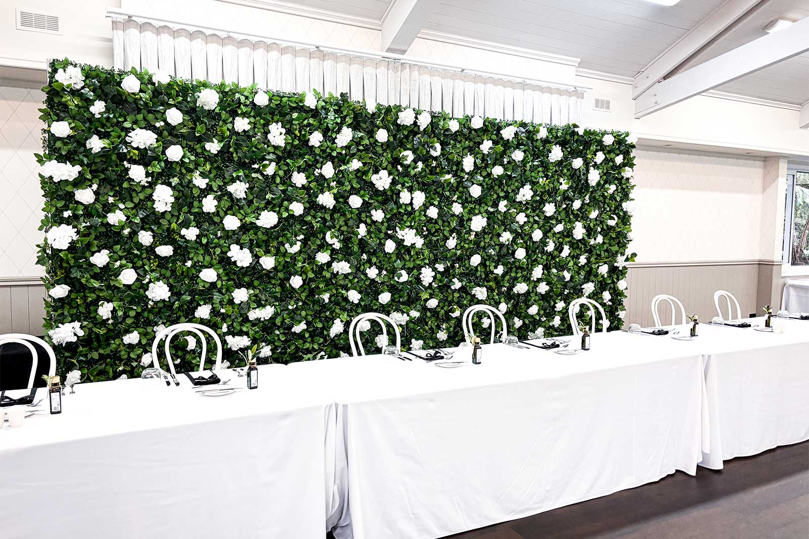 Luxury flower wall backdrop for wedding ceremony and reception hire in Auckland, New Zealand.