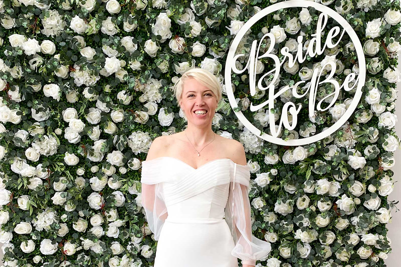 Flower wall backdrop with Bride to Be sign creating an elegant photo area for hen parties and bridal showers