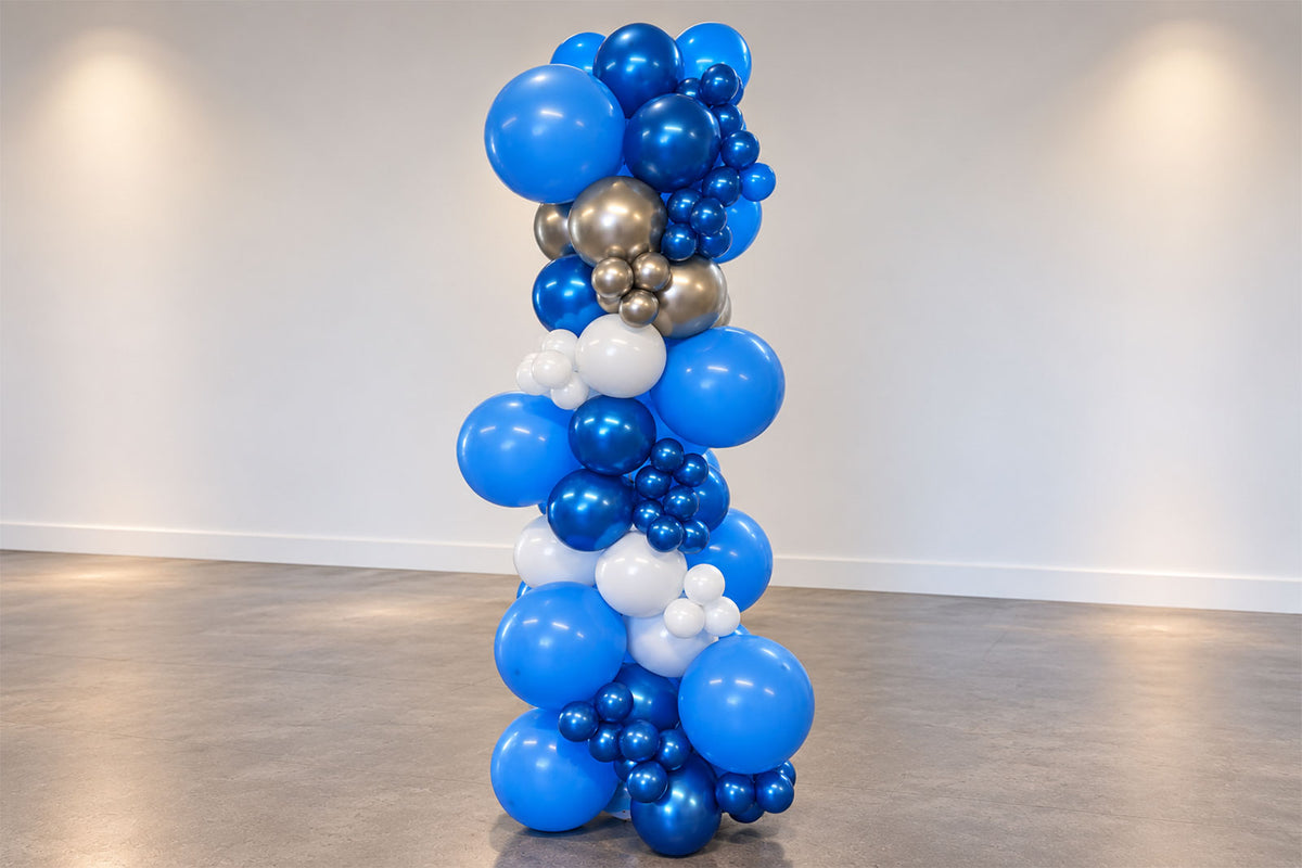 Freestanding balloon garland installation in a stylish event space