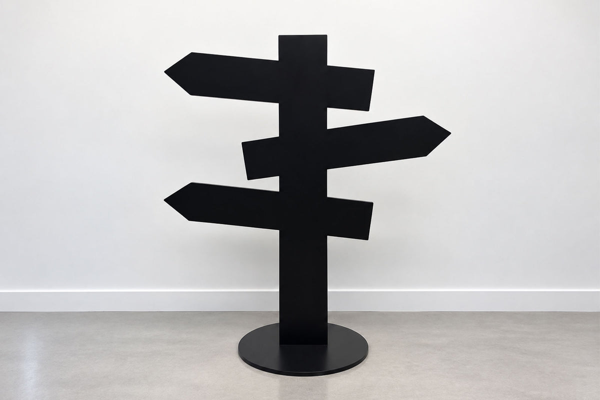 Freestanding black directional sign with three arrow panels for events