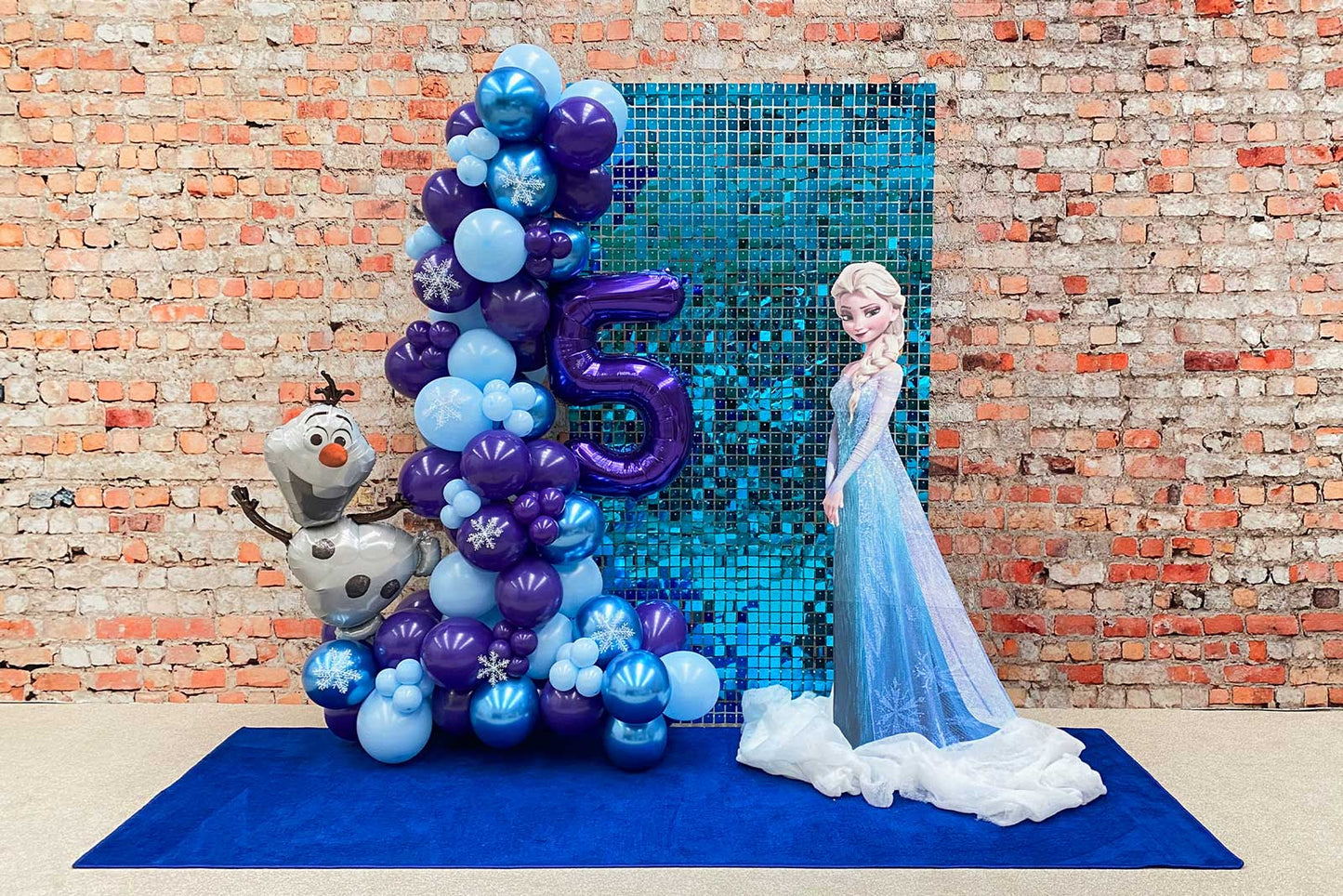 Frozen-themed backdrop for kids' birthday party or winter event