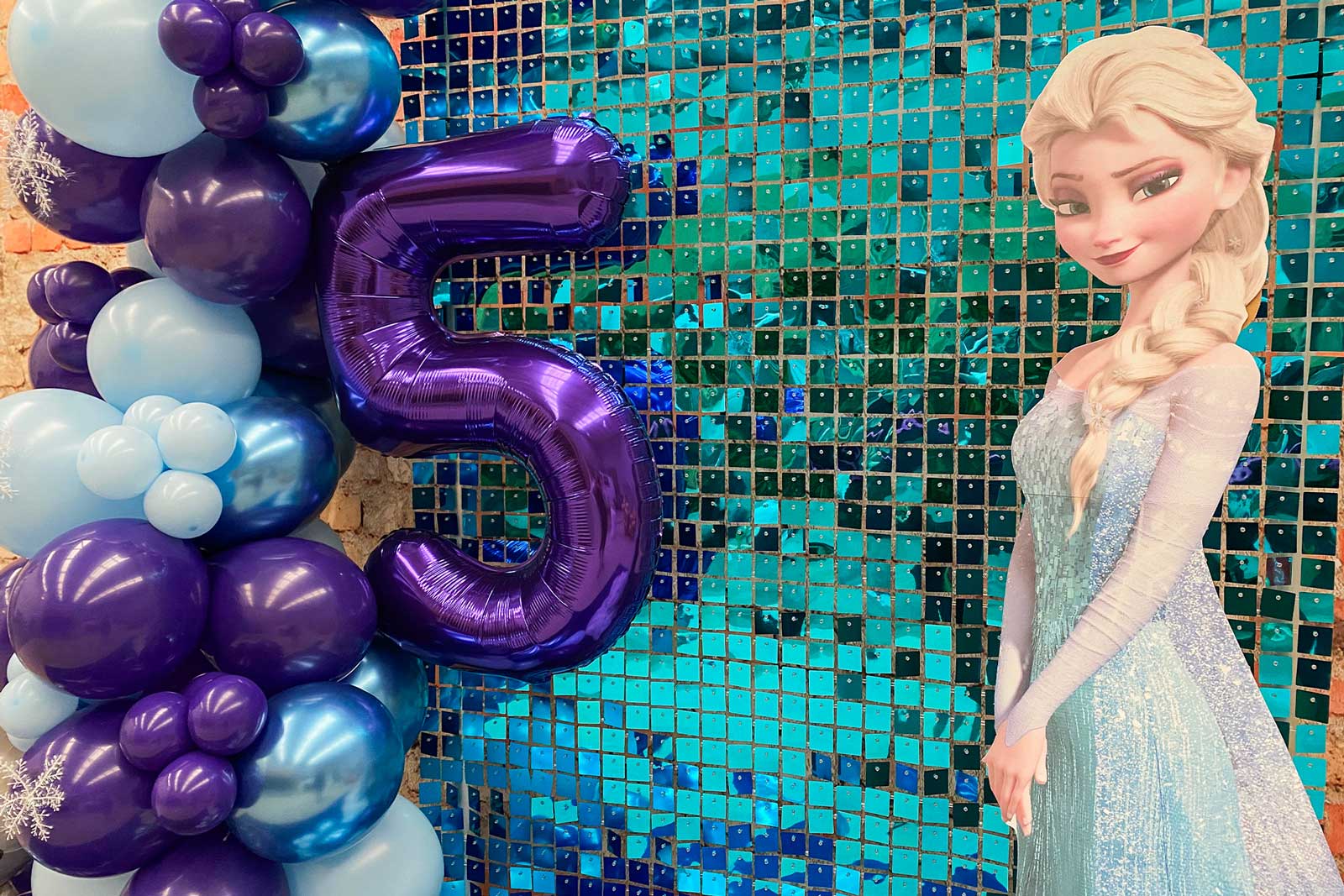 Frozen-inspired photo backdrop for birthday or themed party