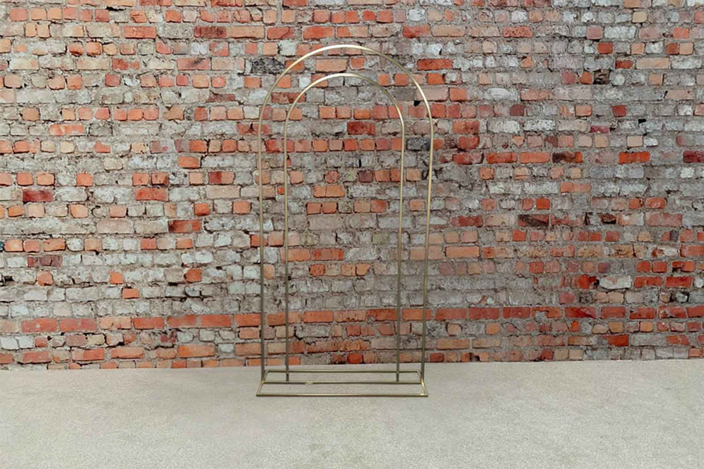 Gold archway backdrop creating a glamorous and elegant photo area for events